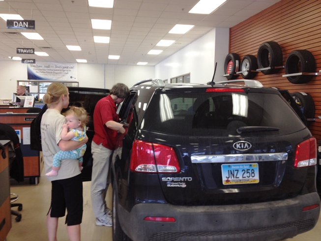 technician inspecting a car seat